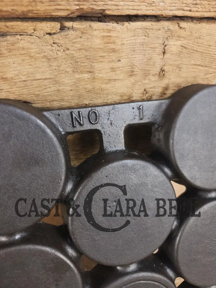 Most rare variation (Rarity 6) Fully Marked Griswold No. 1 Gem Pan Block Logo 11 cup p/n 940. This piece is flat out