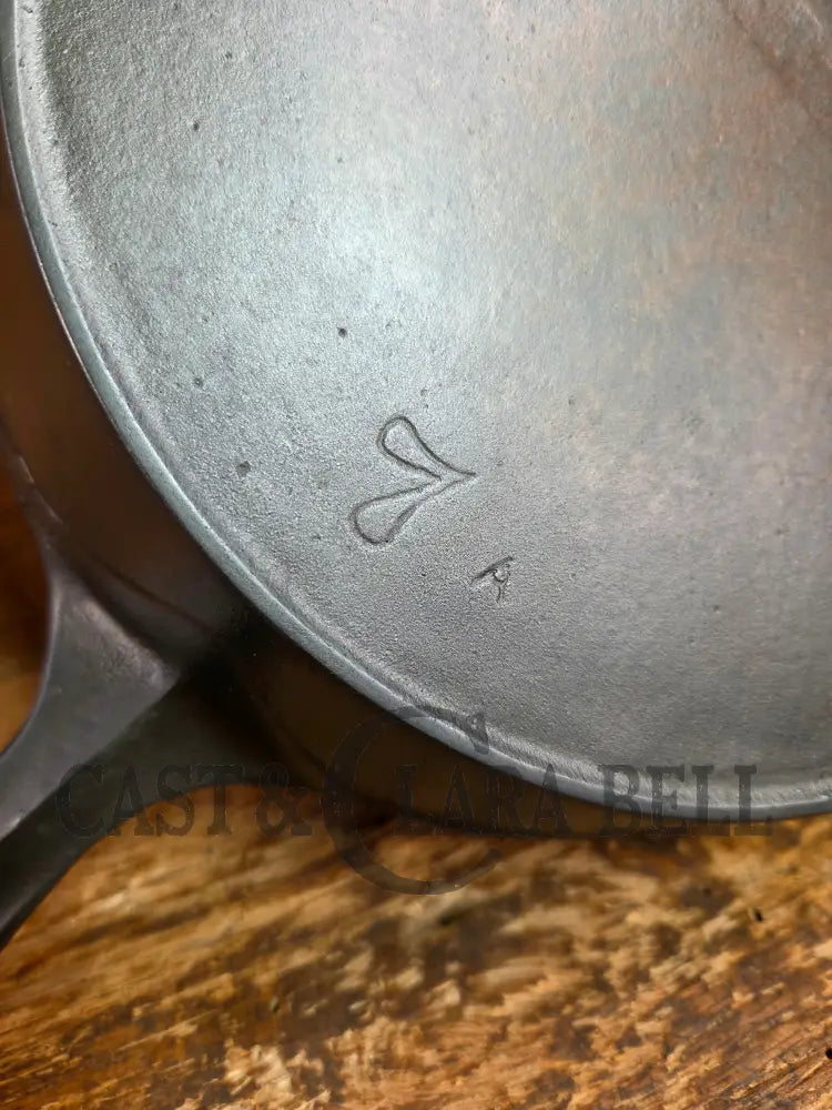 So unique! 1930βs Favorite Piqua Ware #7 Cast Iron Skillet Smiley Logo and Ghostmark CHF logo Skillet