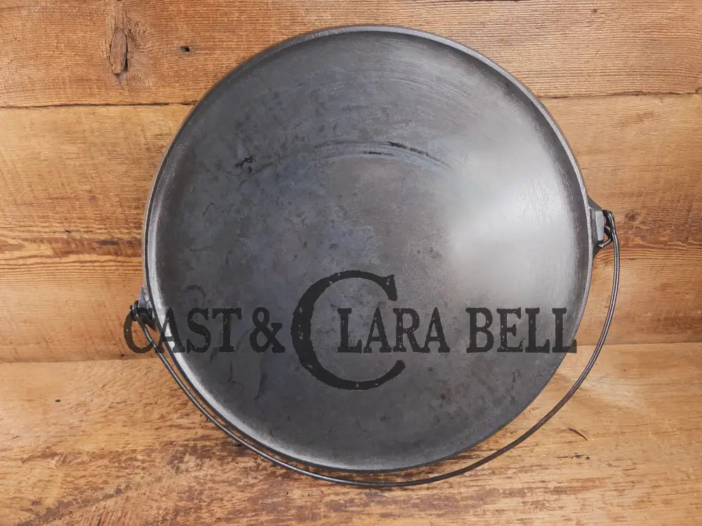 Spectacular piece! 1910โs #742 Griswold No. 14 Round Griddle w/ Bail and Slant Logo. The largest made of its kind and