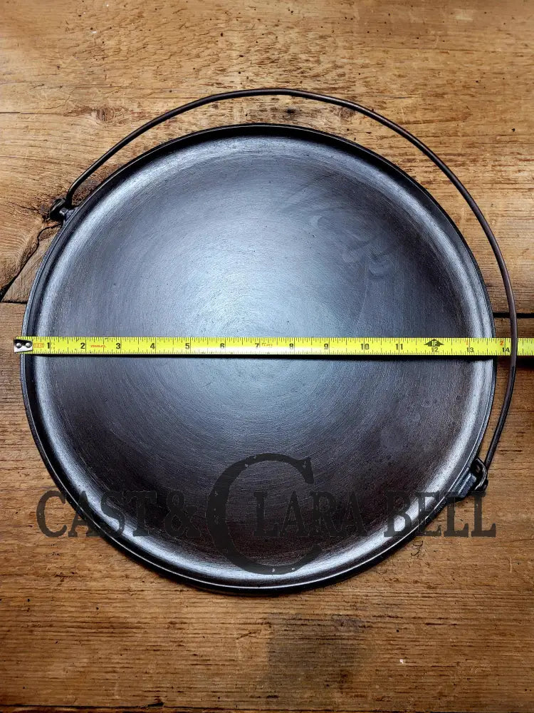 Spectacular piece! 1910’s #742 Griswold No. 14 Round Griddle w/ Bail and Slant Logo. The largest made of its kind and