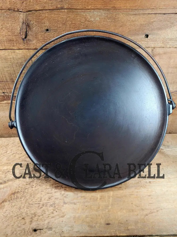 Spectacular piece! 1910βs #742 Griswold No. 14 Round Griddle w/ Bail and Slant Logo. The largest made of its kind and