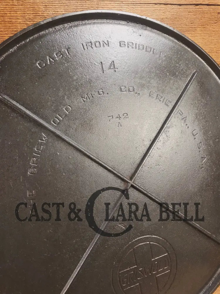 Spectacular piece! 1910โs #742 Griswold No. 14 Round Griddle w/ Bail and Slant Logo. The largest made of its kind and