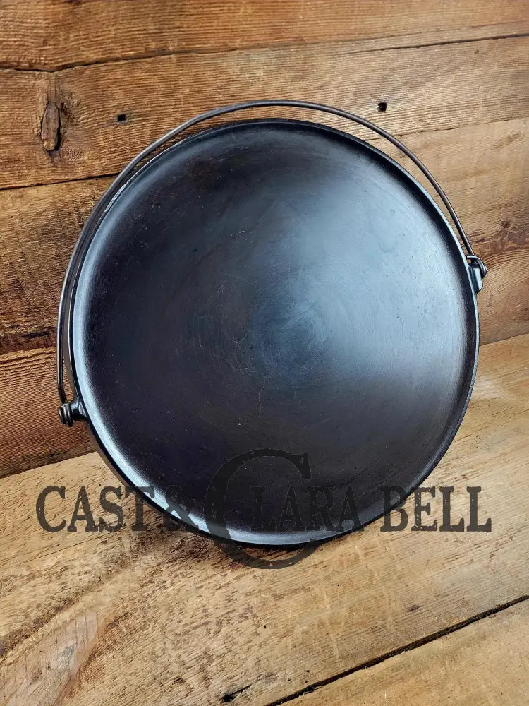 Spectacular piece! 1910’s #742 Griswold No. 14 Round Griddle w/ Bail and Slant Logo. The largest made of its kind and