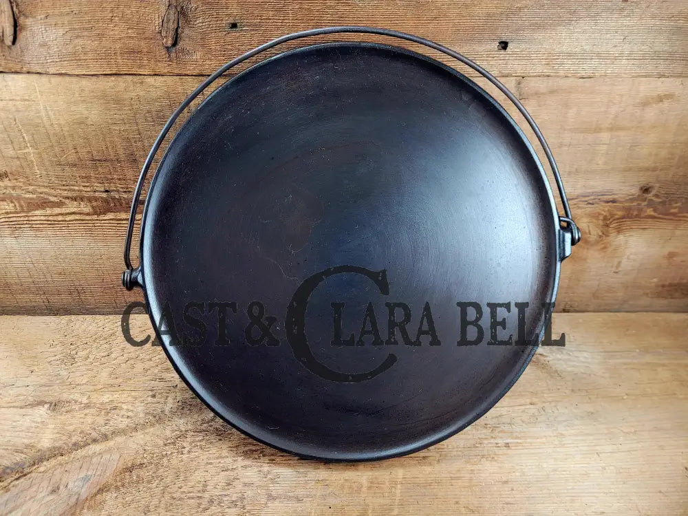 Spectacular piece! 1910’s #742 Griswold No. 14 Round Griddle w/ Bail and Slant Logo. The largest made of its kind and