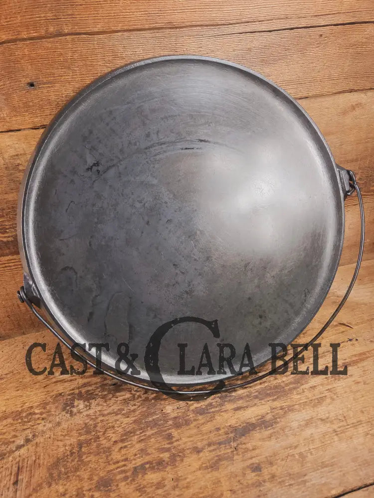 Spectacular piece! 1910โs #742 Griswold No. 14 Round Griddle w/ Bail and Slant Logo. The largest made of its kind and