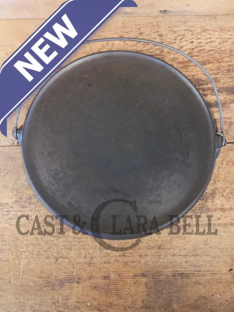 Spectacular piece! Late 1910’s #742 Griswold No. 14 Round Griddle w/ Bail and Slant Logo. The largest made of its kind