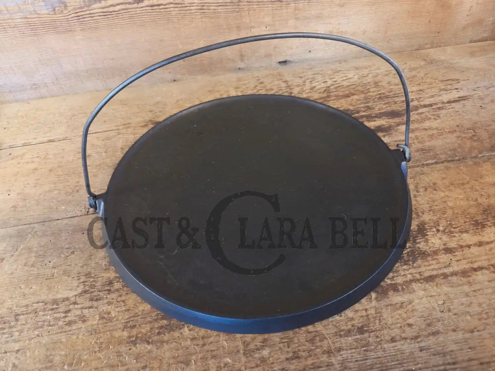 Spectacular piece! Late 1910’s #742 Griswold No. 14 Round Griddle w/ Bail and Slant Logo. The largest made of its kind