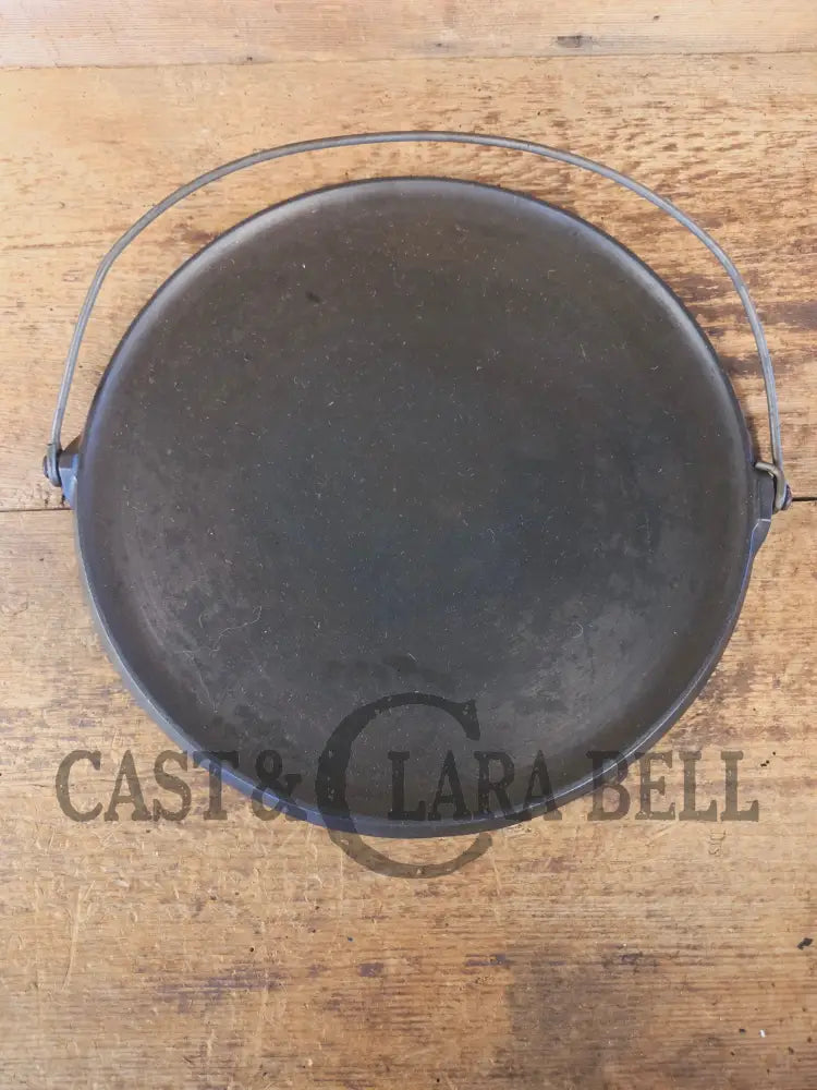 Spectacular piece! Late 1910’s #742 Griswold No. 14 Round Griddle w/ Bail and Slant Logo. The largest made of its kind