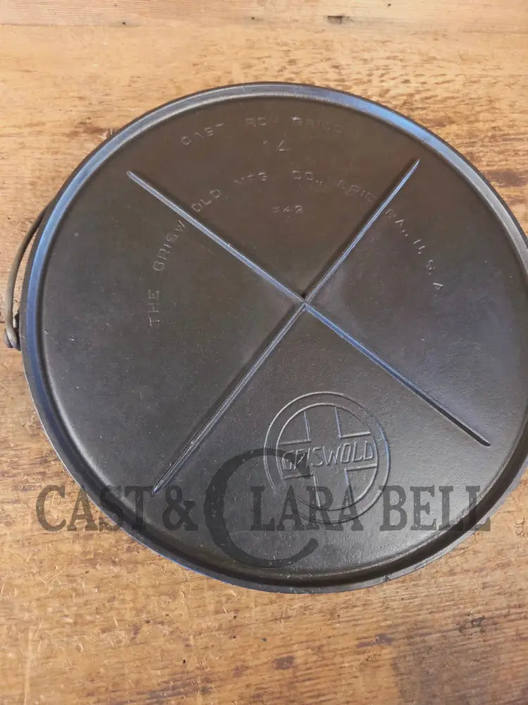 Spectacular piece! Late 1910’s #742 Griswold No. 14 Round Griddle w/ Bail and Slant Logo. The largest made of its kind