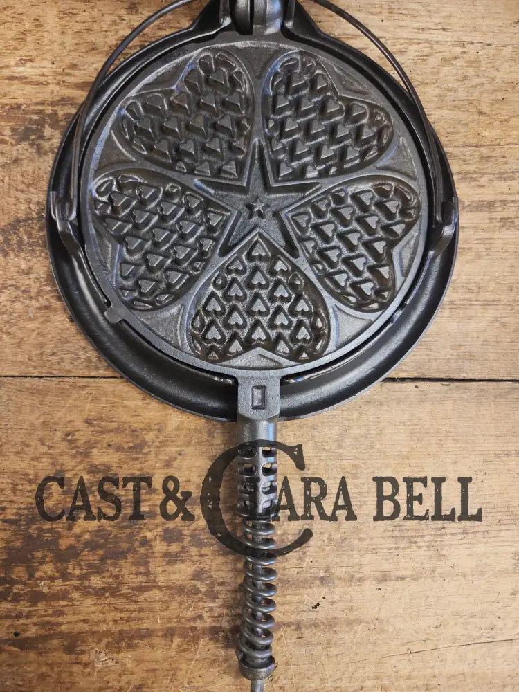 Stunning. The Premier waffle iron! Griswold No. 18 ’Heart and Star’ (919/920) Waffle Iron. Bailed Low Base. Makes the