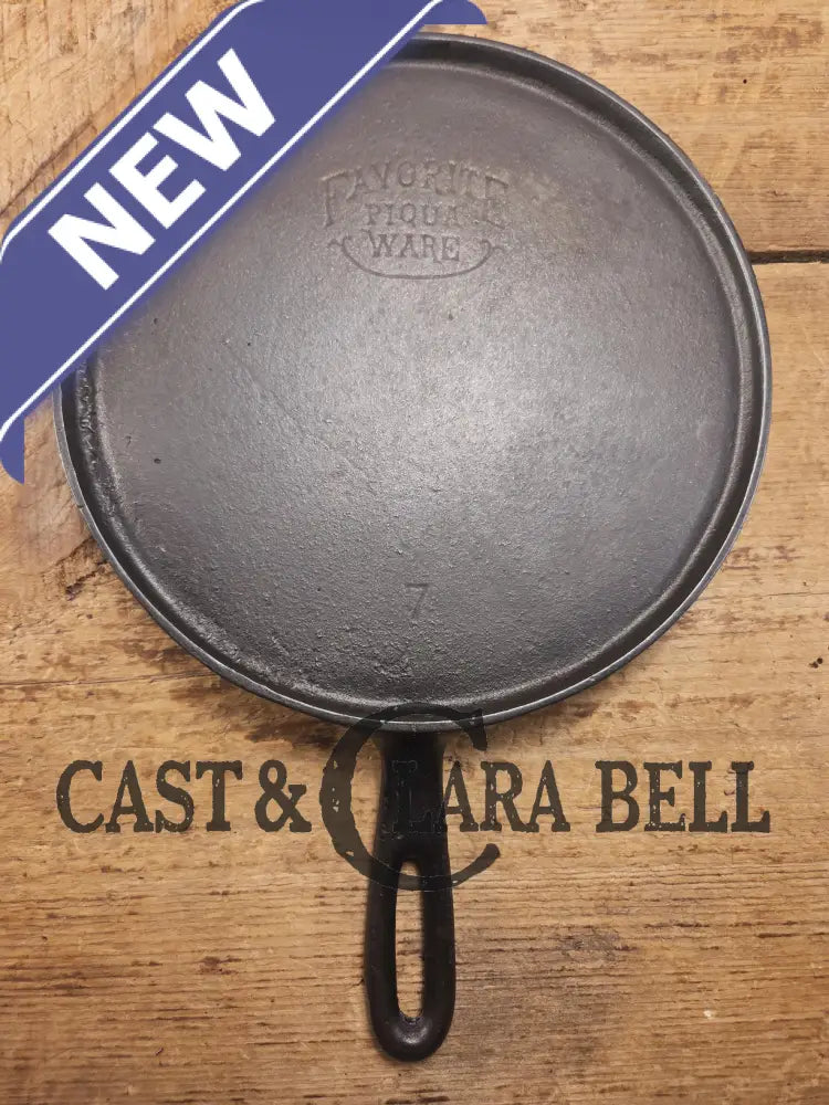 Tougher to find. 1920’s Favorite Piqua Ware #7 Round Cast Iron Griddle with Smiley Logo. Perfect grilled cheese and