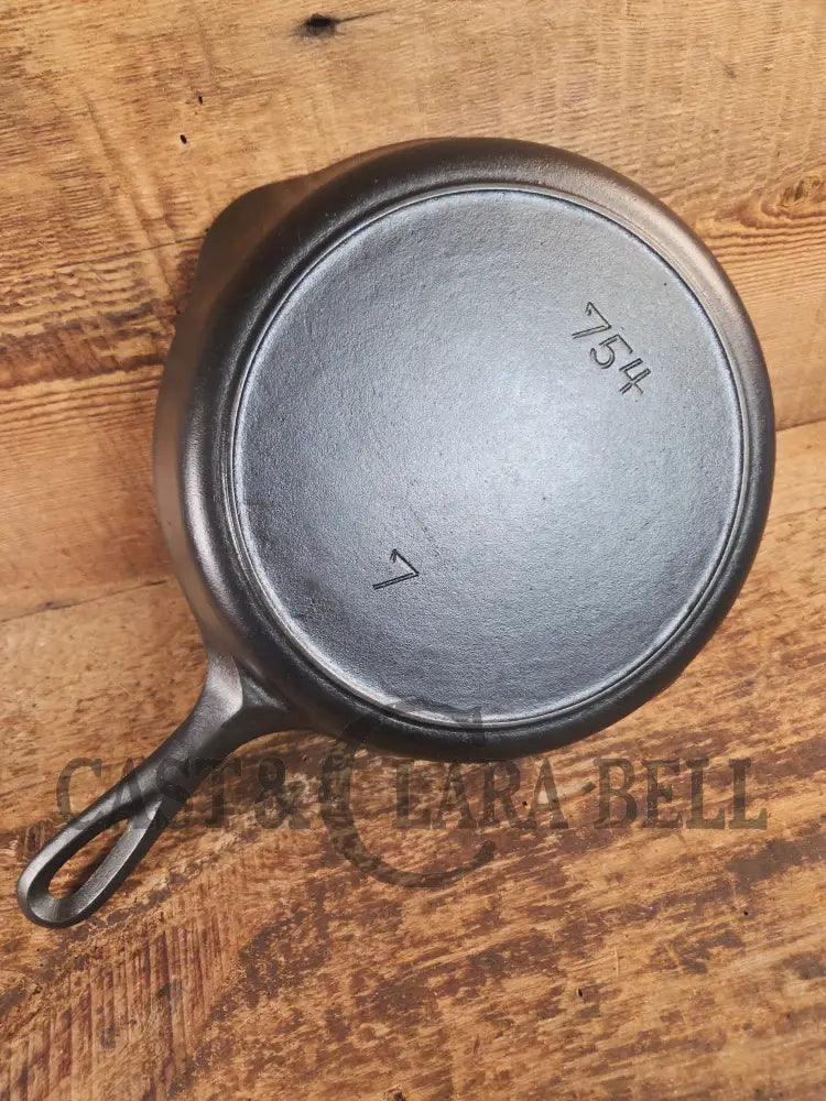 Tougher to find! 1930’s era Griswold #7 Cast Iron Skillet with Heat Ring 754. Similar to the Victor design. Great pan!