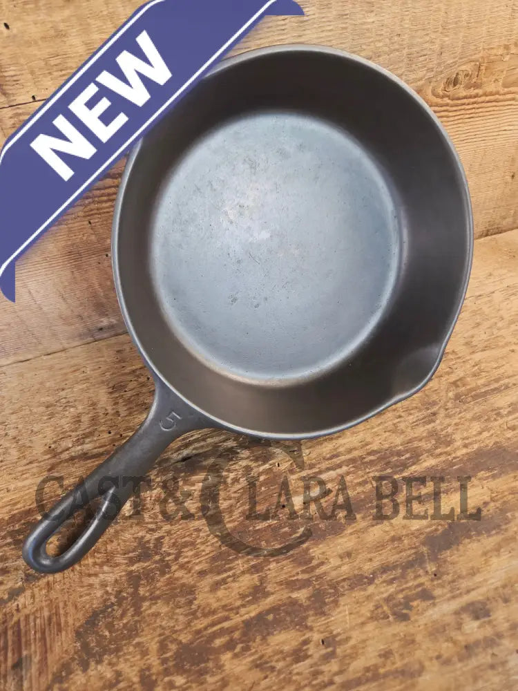 Unmarked #5 Saute Skillet with Heat Ring. An Awesome sauce pan! Looks very similar to Wagner - Skillet