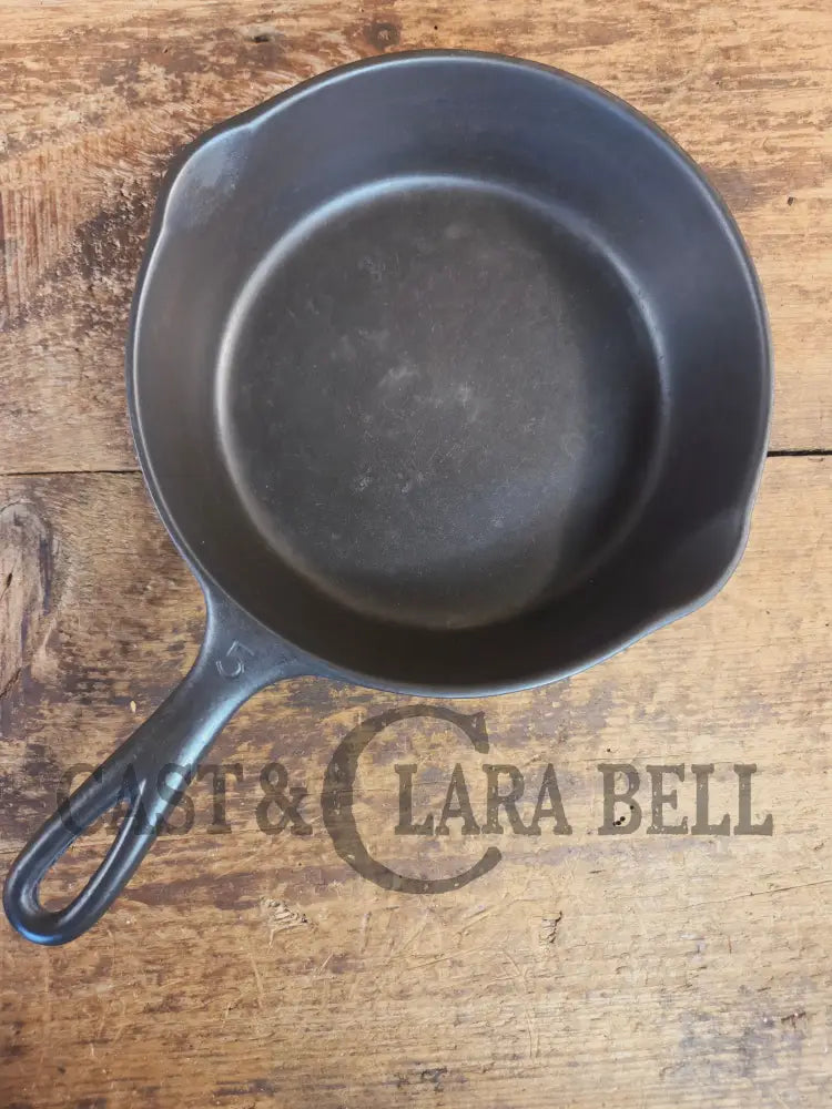 Unmarked #5 Saute Skillet with Heat Ring. An Awesome sauce pan! Looks very similar to Wagner - Skillet