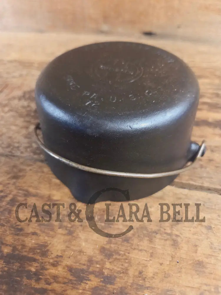 Very cool mini cast piece. 1940’s Griswold Cast Iron Patty Bowl with bailed handle. Great utility piece! - Dutch Ovens