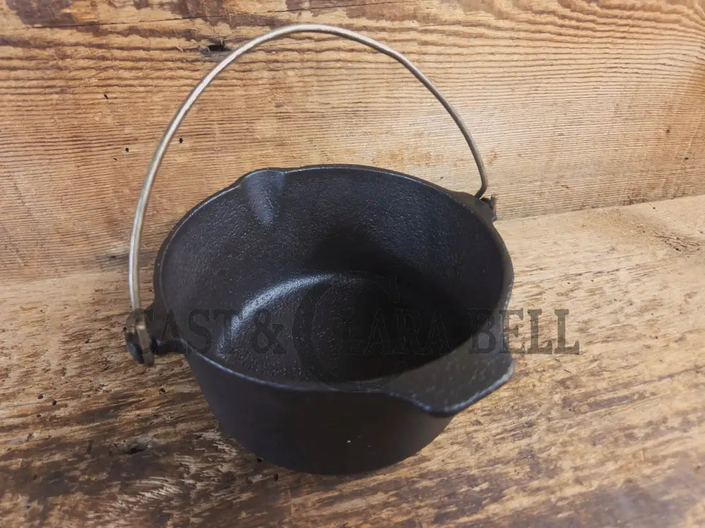 Very cool mini cast piece. 1940’s Griswold Cast Iron Patty Bowl with bailed handle. Great utility piece! - Dutch Ovens