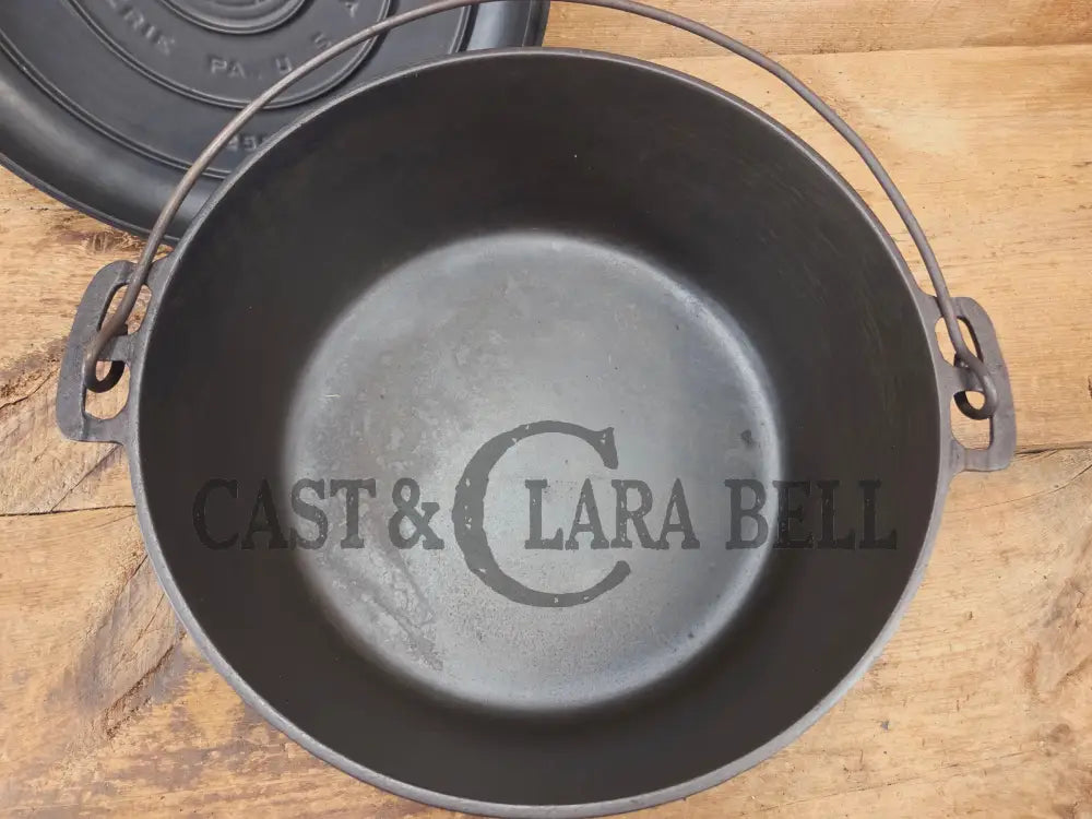 WOW. Not seen often! Griswold first series Slant Logo w/ ERIE Dutch oven Size #10 (835) Dutch Oven with ERIE Logo &