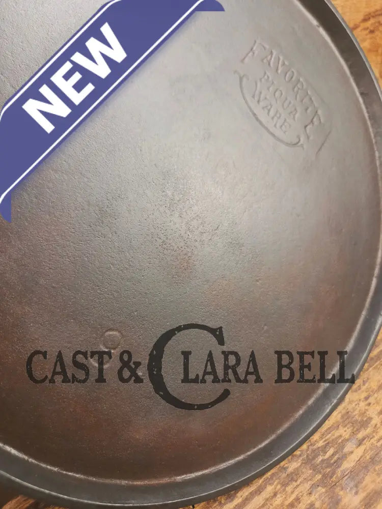 1920’s Favorite Piqua Ware #9 Round Cast Iron Griddle with Smiley Logo and Ghost mark block logo. Griddle