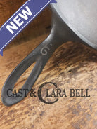 1920’s Favorite Piqua Ware #9 Round Cast Iron Griddle with Smiley Logo and Ghost mark block logo. Griddle