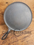 1920’s Favorite Piqua Ware #9 Round Cast Iron Griddle with Smiley Logo and Ghost mark block logo. Griddle