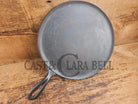 1920’s Favorite Piqua Ware #9 Round Cast Iron Griddle with Smiley Logo and Ghost mark block logo. Griddle