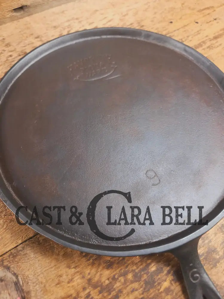 1920’s Favorite Piqua Ware #9 Round Cast Iron Griddle with Smiley Logo and Ghost mark block logo. Griddle