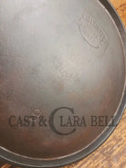 1920’s Favorite Piqua Ware #9 Round Cast Iron Griddle with Smiley Logo and Ghost mark block logo. Griddle