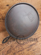 1920’s Favorite Piqua Ware #9 Round Cast Iron Griddle with Smiley Logo and Ghost mark block logo. Griddle