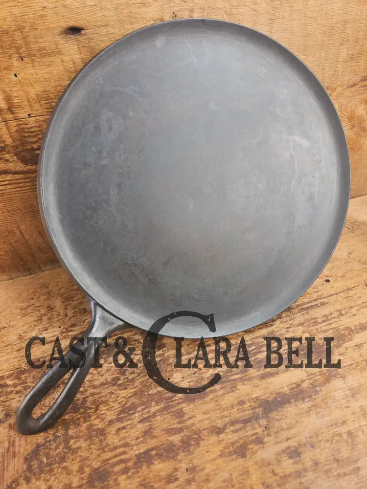 1920’s Favorite Piqua Ware #9 Round Cast Iron Griddle with Smiley Logo and Ghost mark block logo. Griddle