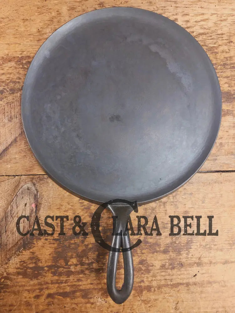 1920’s Favorite Piqua Ware #9 Round Cast Iron Griddle with Smiley Logo and Ghost mark block logo. Griddle