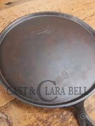 1920’s Favorite Piqua Ware #9 Round Cast Iron Griddle with Smiley Logo and Ghost mark block logo. Griddle