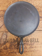 1920’s Favorite Piqua Ware #9 Round Cast Iron Griddle with Smiley Logo and Ghost mark block logo. Griddle