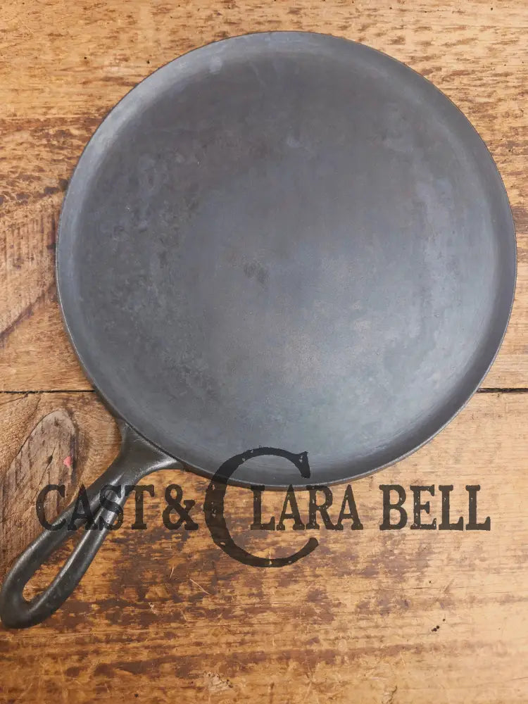 1920’s Favorite Piqua Ware #9 Round Cast Iron Griddle with Smiley Logo and Ghost mark block logo. Griddle