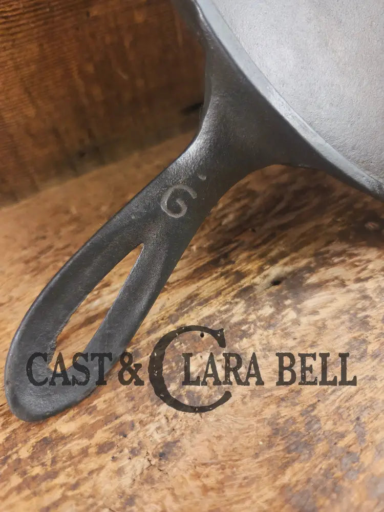 1920’s Favorite Piqua Ware #9 Round Cast Iron Griddle with Smiley Logo and Ghost mark block logo. Griddle