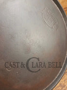 1920’s Favorite Piqua Ware #9 Round Cast Iron Griddle with Smiley Logo and Ghost mark block logo. Griddle