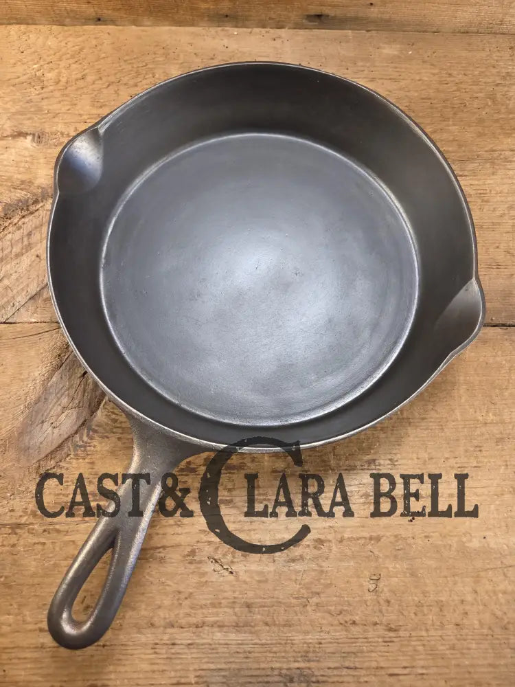 1920’s Favorite Piqua Ware No. 9 B cast iron Skillet with Heat Ring and ’Smiley’ Logo. Gorgeous skillet restored and