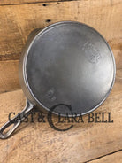 1920’s Favorite Piqua Ware No. 9 B cast iron Skillet with Heat Ring and ’Smiley’ Logo. Gorgeous skillet restored and