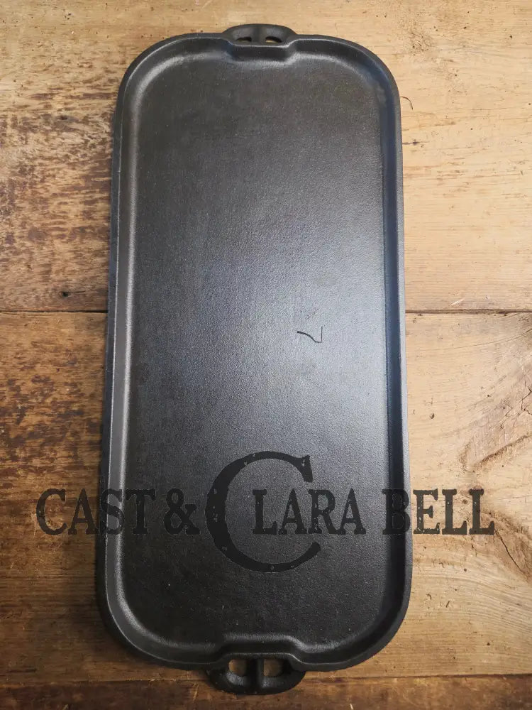 1930’s era Lodge 7 Long Griddle. Very handy size to have for the grill or stove top! Restored and ready to Use! Skillet