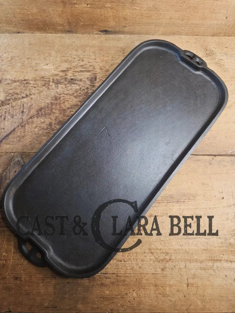 1930’s era Lodge 7 Long Griddle. Very handy size to have for the grill or stove top! Restored and ready to Use! Skillet