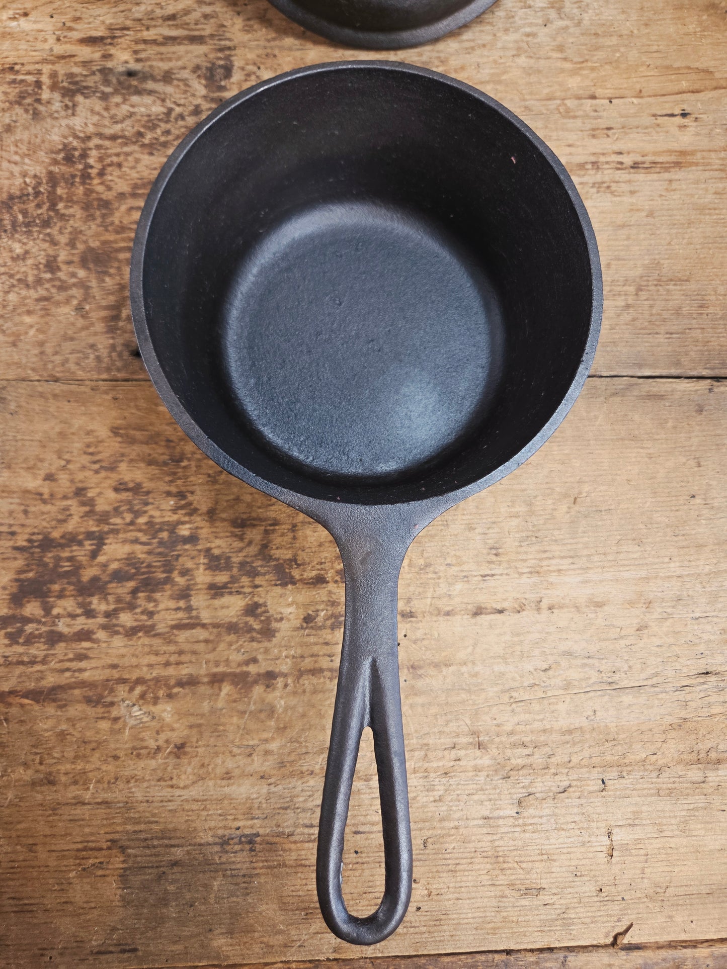 Lovely Lodge #2 quart sauce pan with lid!  Perfect bean pot for your grill!