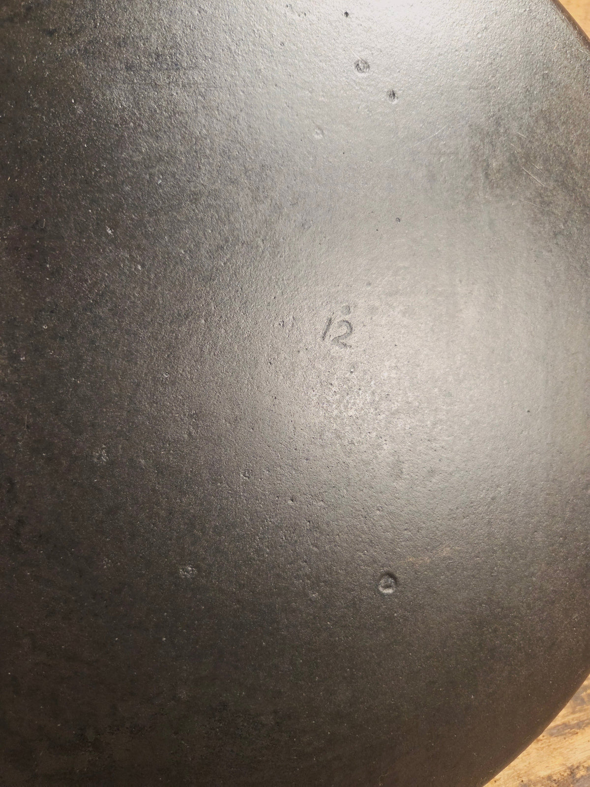 Awesome and tough to find! Scarce smooth bottom #12 Vollrath cast iron skillet. This is a conversation starter! Skillet