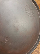 1920’s Favorite Piqua Ware #9 Round Cast Iron Griddle with Smiley Logo and Ghost mark block logo. Griddle