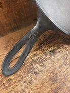 1920’s Favorite Piqua Ware #9 Round Cast Iron Griddle with Smiley Logo and Ghost mark block logo. Griddle