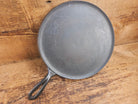 1920’s Favorite Piqua Ware #9 Round Cast Iron Griddle with Smiley Logo and Ghost mark block logo. Griddle