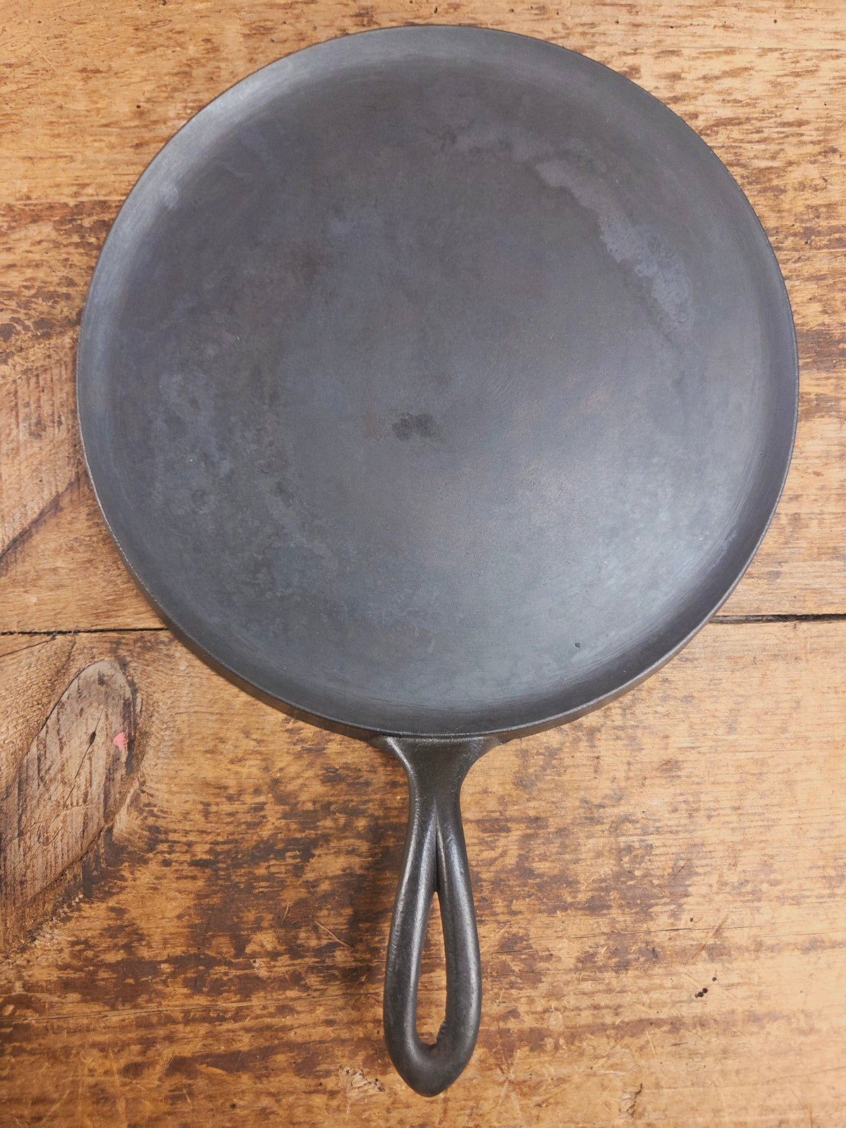1920’s Favorite Piqua Ware #9 Round Cast Iron Griddle with Smiley Logo and Ghost mark block logo. Griddle