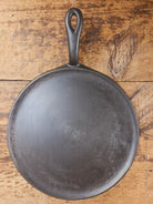 Gorgeous and not often seen #9 Puritan round griddle by Griswold. Perfect for everyday pancakes grilled cheese or oven