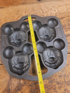 So cool! Lodge made Mickey Mouse Gem Pan. Makes great mini cakes! - Bakeware