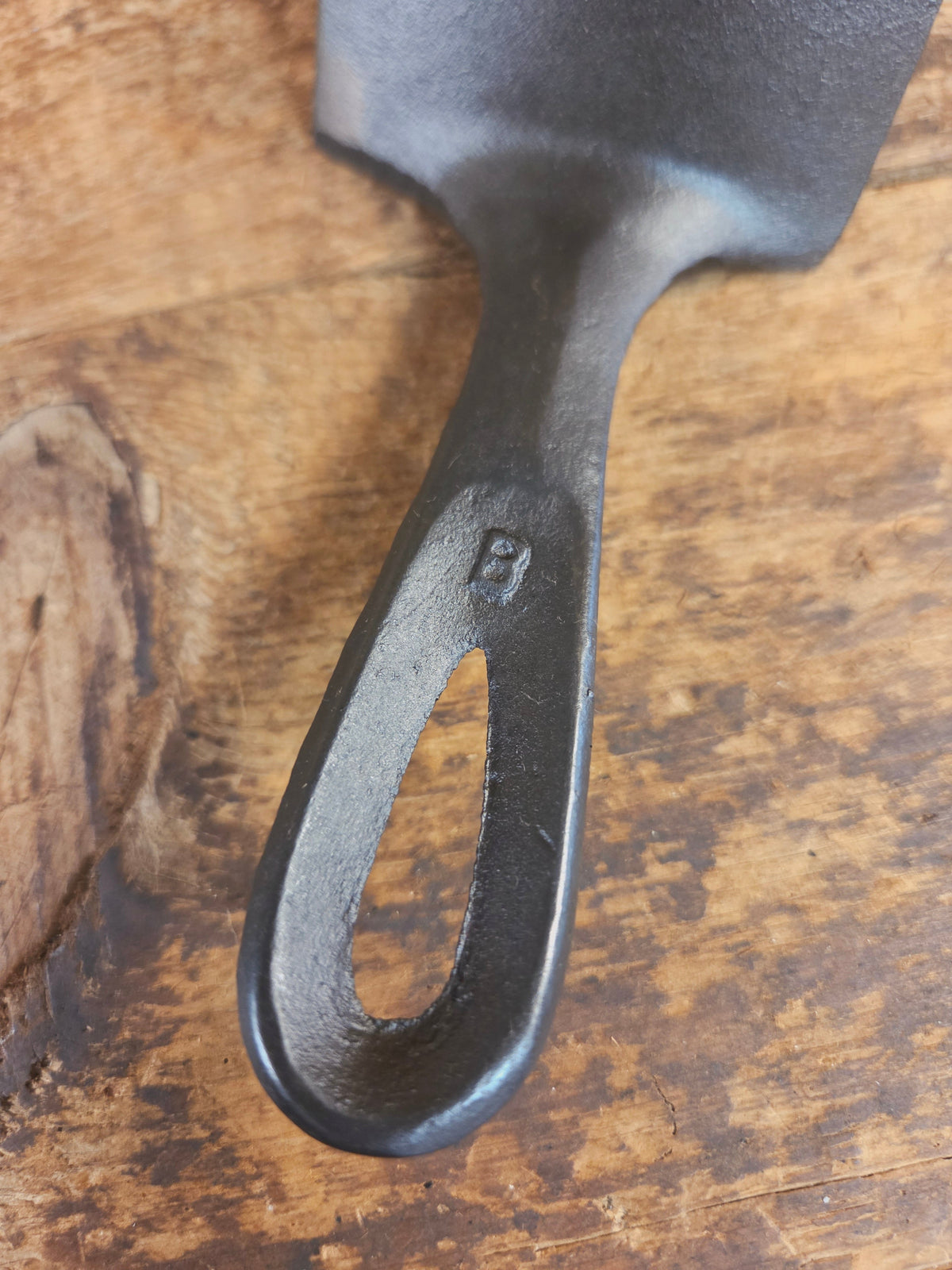 Custom made #5 Lodge Cast Iron Skillet Spatula w RAISED B. Reclaimed from a early to mid 1900’s single notch Lodge