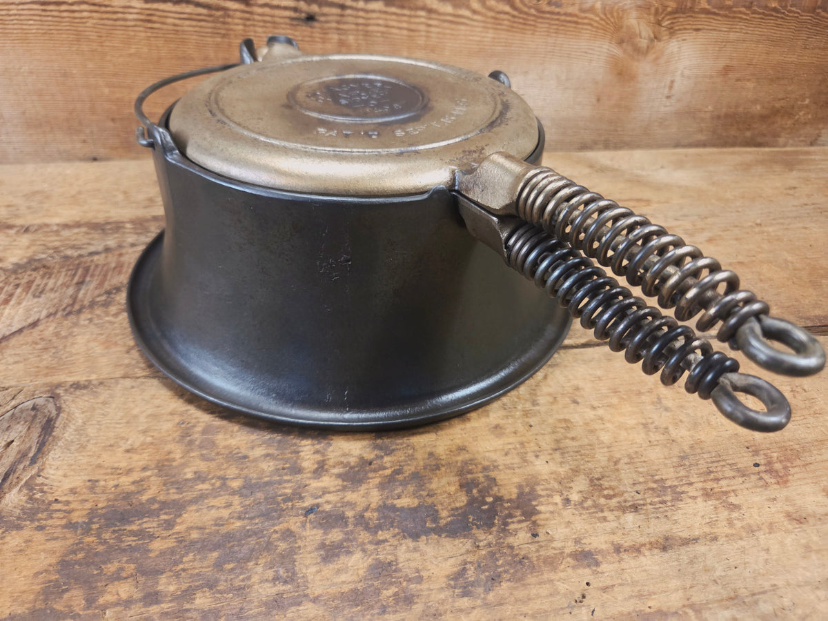 For the eclectic enthusiast!! 1930’s Era Wagner Tall Base Waffle Iron with Nickel Finish Paddles! Really cool patina!