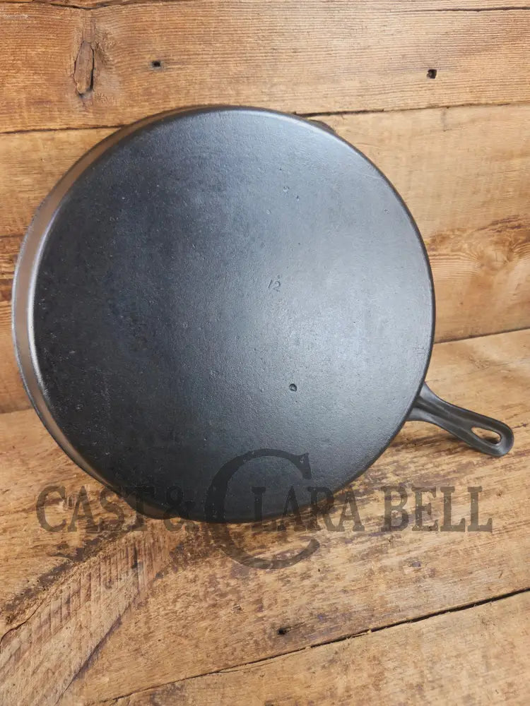Awesome and tough to find! Scarce smooth bottom #12 Vollrath cast iron skillet. This is a conversation starter! Skillet